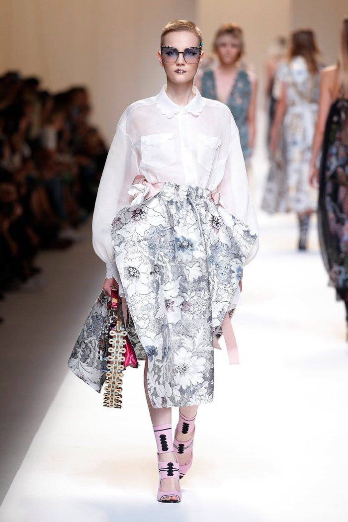Fendi Spring 2017: Lina Hoss walks the runway in white blouse with floral print skirt featuring draping