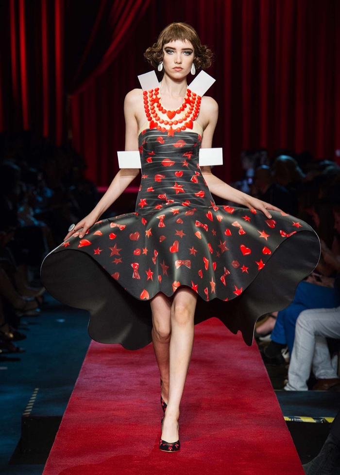 Moschino Spring 2017: Grace Hartzel walks the runway in cut-out printed dress featuring hearts, stars, lips and bows