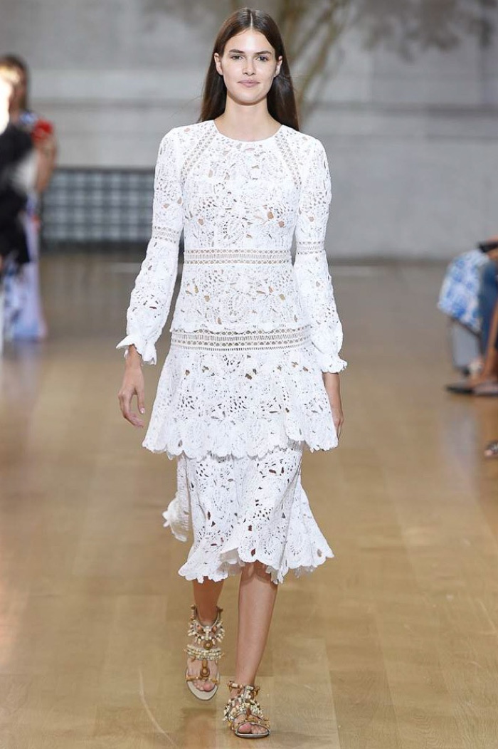 Oscar de la Renta Spring 2017: Model walks the runway in white crochet dress with tiered layers