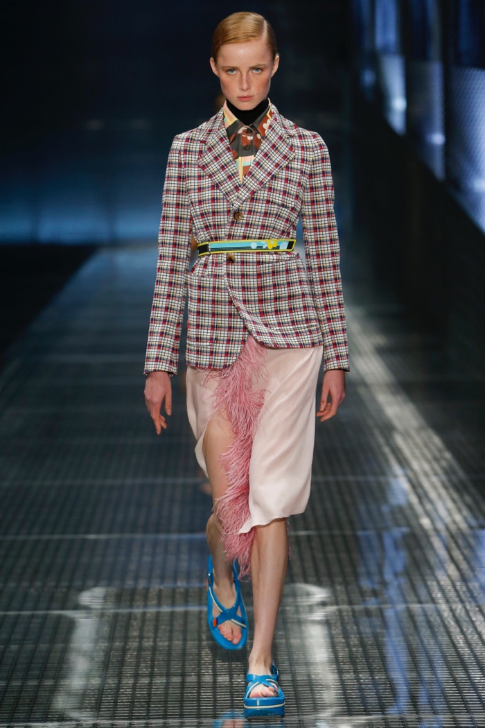 Prada Spring 2017: Model walks runway in plaid jacket over feather-trimmed skirt