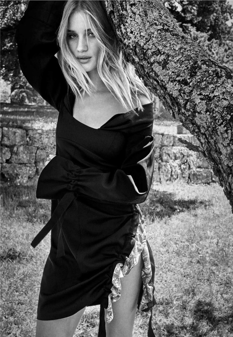 Photographed in black and white, Rosie Huntington-Whiteley wears Dior dress