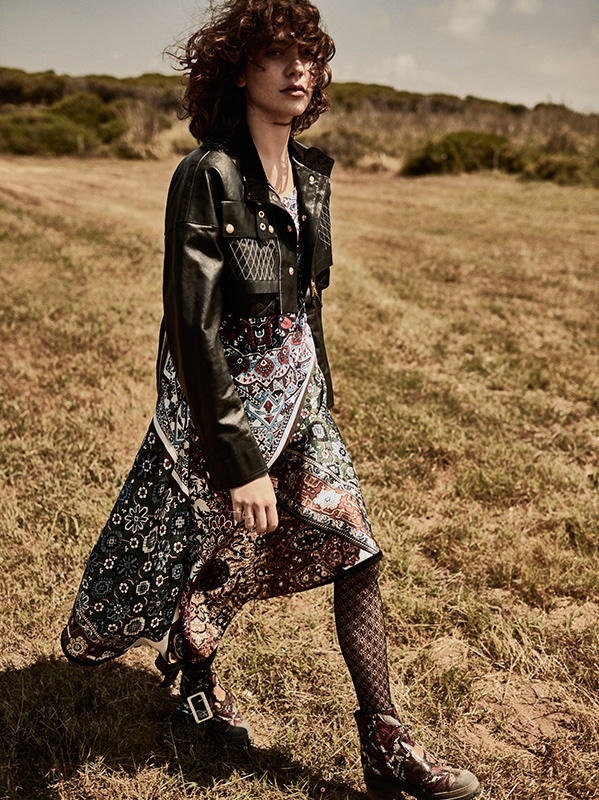 Model Steffy Argelich wears Louis Vuitton cropped leather jacket and printed dress