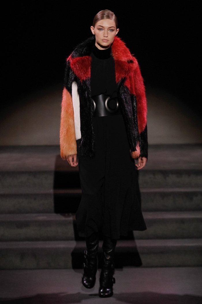 Tom Ford Fall 2016: Gigi Hadid walks the runway in multicolored coat with long black dress