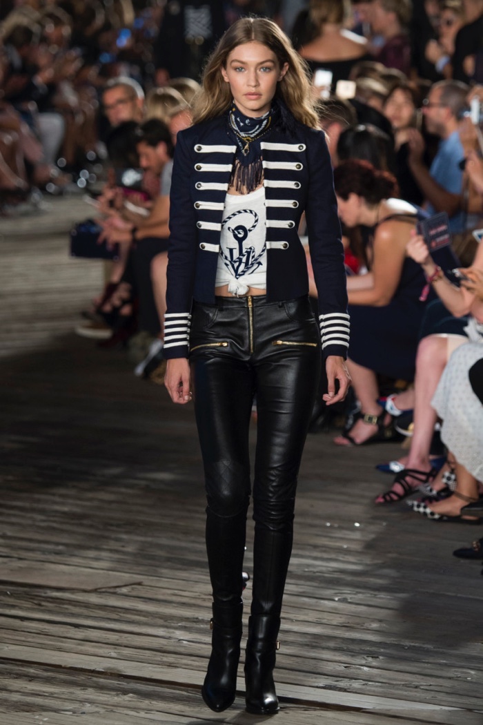 Tommy Hilfiger Fall 2016: Gigi Hadid walks the runway wearing band inspired jacket, t-shirt and leather pants