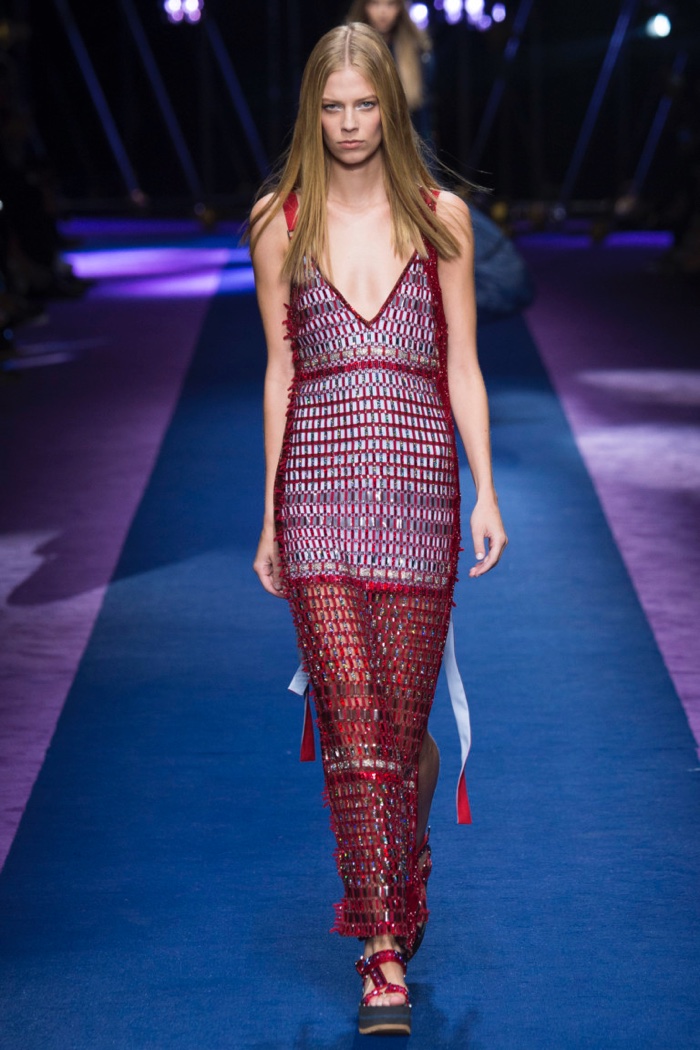 Versace Spring 2017: Lexi Boling walks the runway in red crystal embellished mesh dress with plunging neckline