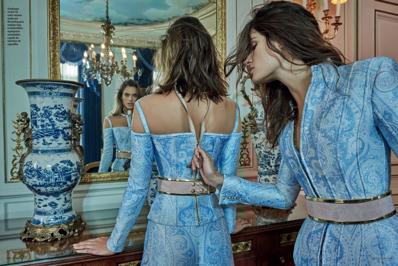 Isabeli Fontana zips Alessandra Ambrosio up in a brocade look from Parisian label Balmain.