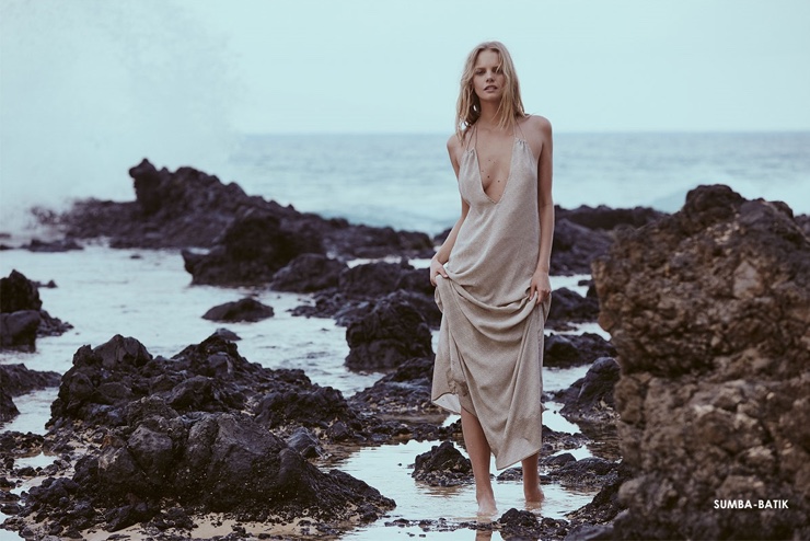 The model poses at the beach in Acacia Sumba dress in Batik