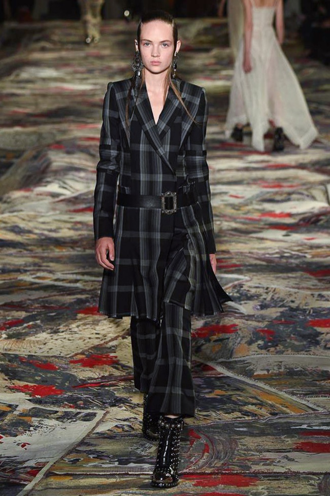 Alexander McQueen Spring 2017: Model walks the runway in plaid jacket and pants