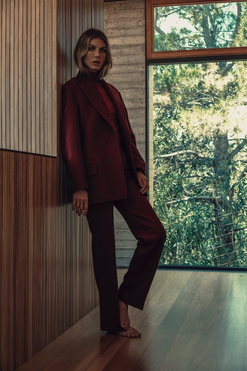Suiting up, Angela Lindvall poses in burgundy suit jacket and matching pants