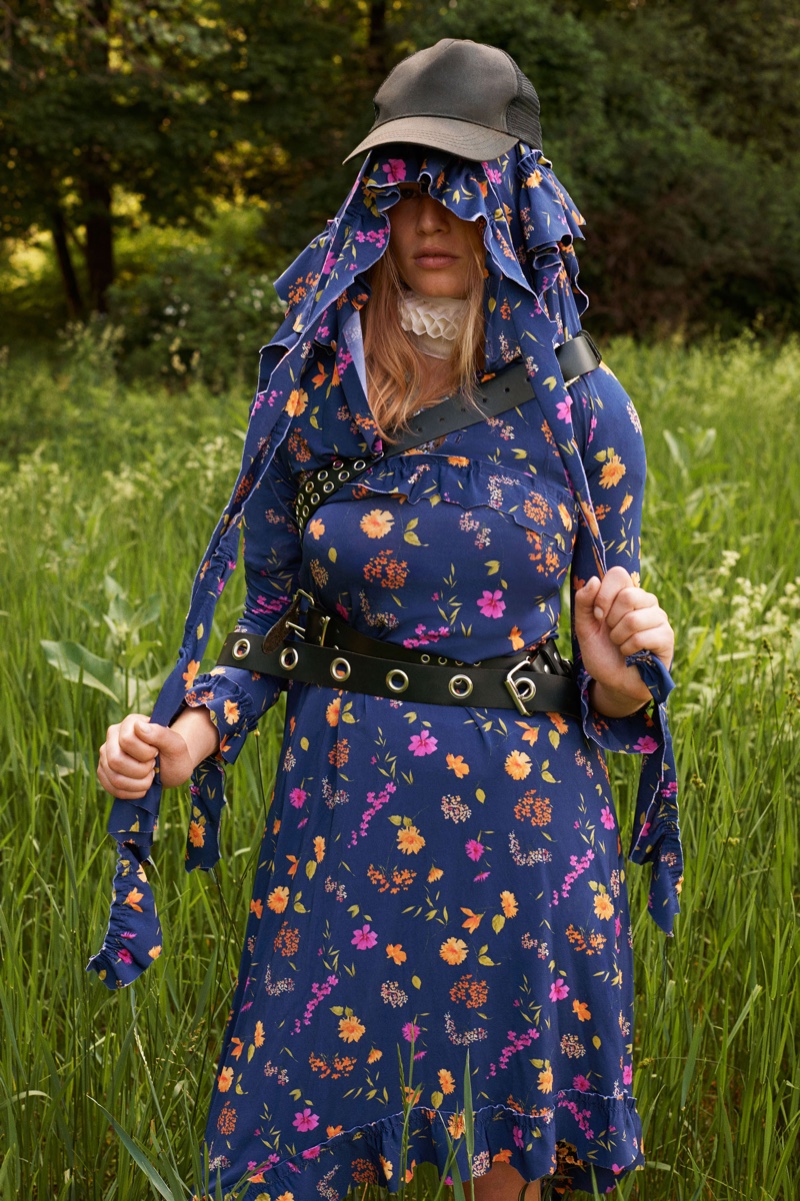 A floral print dress from Vetements stands out with a vintage baseball cap