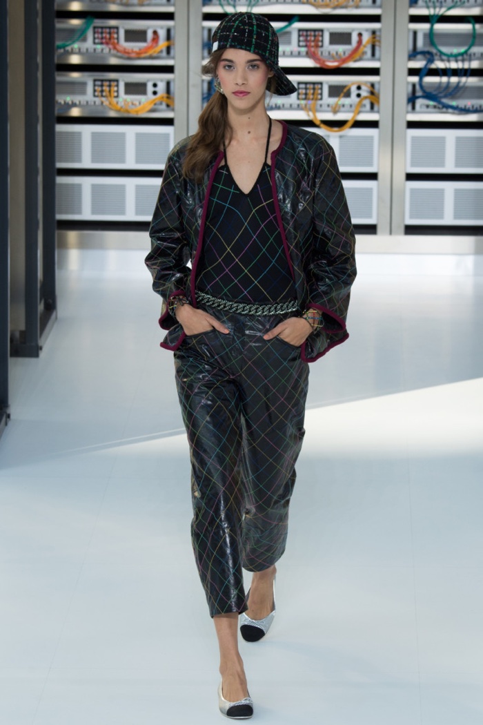Chanel Spring 2017: Model walks the runway in leather jacket and pants with geometric print
