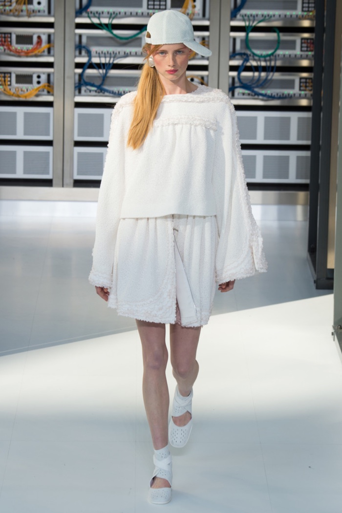 Chanel Spring 2017: Rianne Van Rompaey walks the runway in white sweater over ruffled skirt