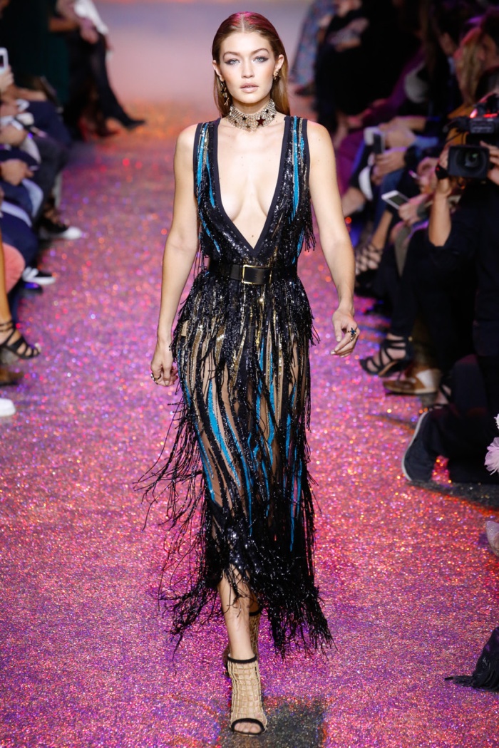 Elie Saab Spring 2017: Gigi Hadid walks the runway in sparkling fringe dress with plunging neckline and belt