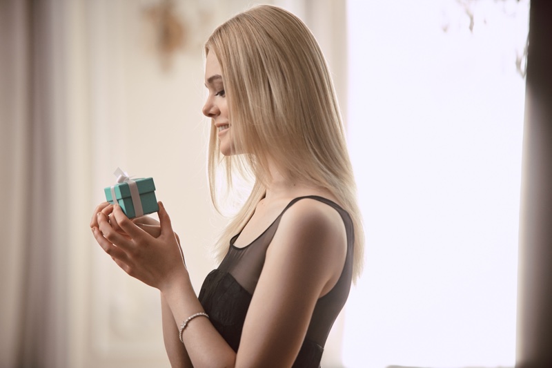 Elle Fanning poses behind the scenes at Tiffany & Co. Holiday 2016 campaign