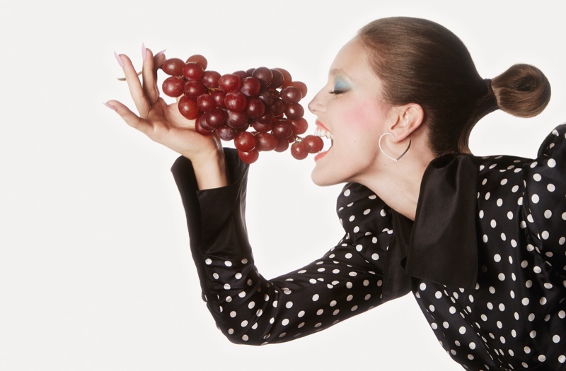 Emily DiDonato eats some grapes in polka dot print top