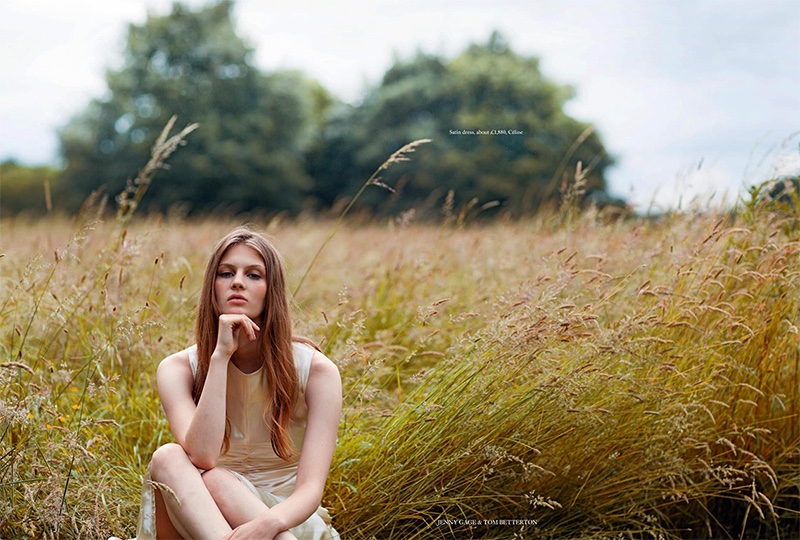 Posing in the grass, Florence Kosky models satin Celine dress
