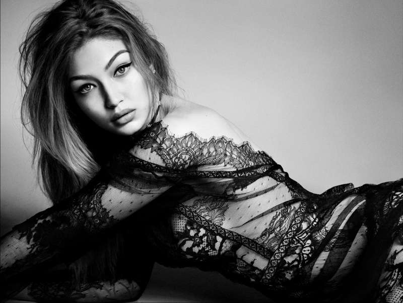 Photographed in black and white, Gigi Hadid wears lace Alberta Ferretti gown