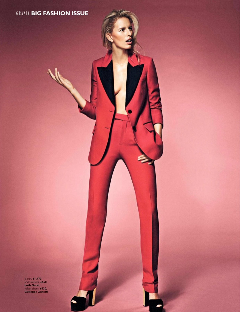 Karolina Kurkova models Gucci jacket and pants with Giuseppe Zanotti platform heels