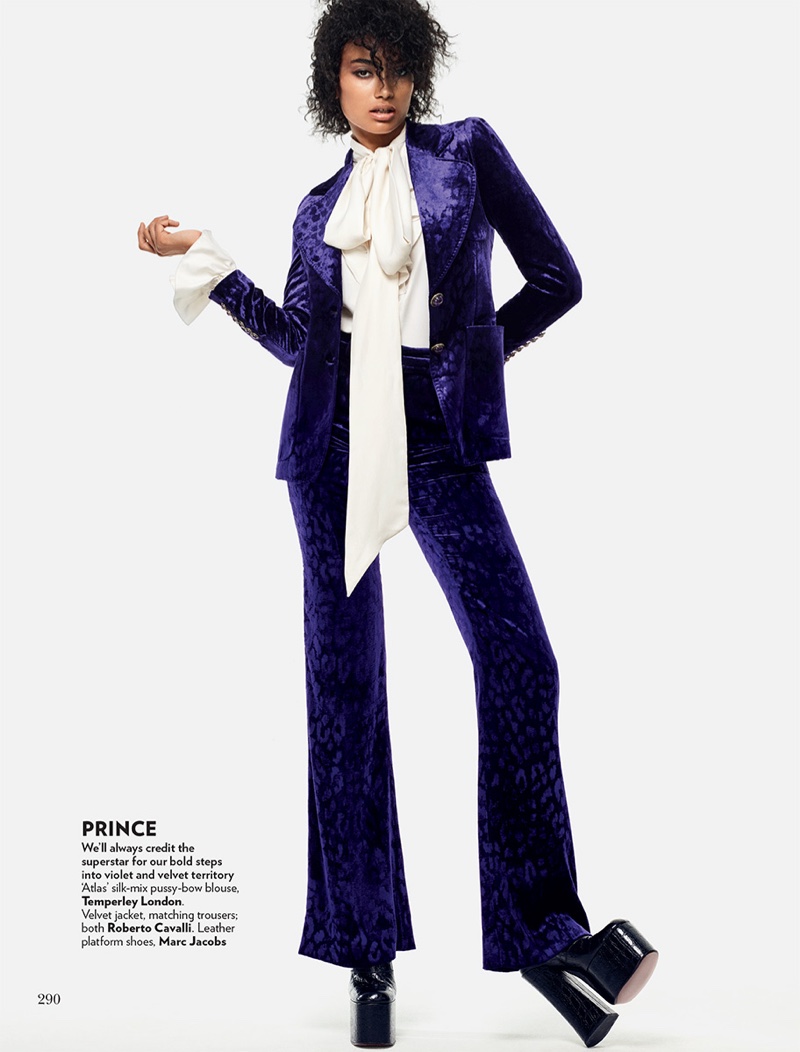 Channeling Prince, Kelly Gale wears purple velvet jacket and pants from Roberto Cavalli
