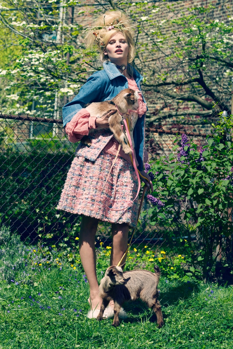 Lara Stone poses in denim and tweed jacket from Chanel with matching skirt