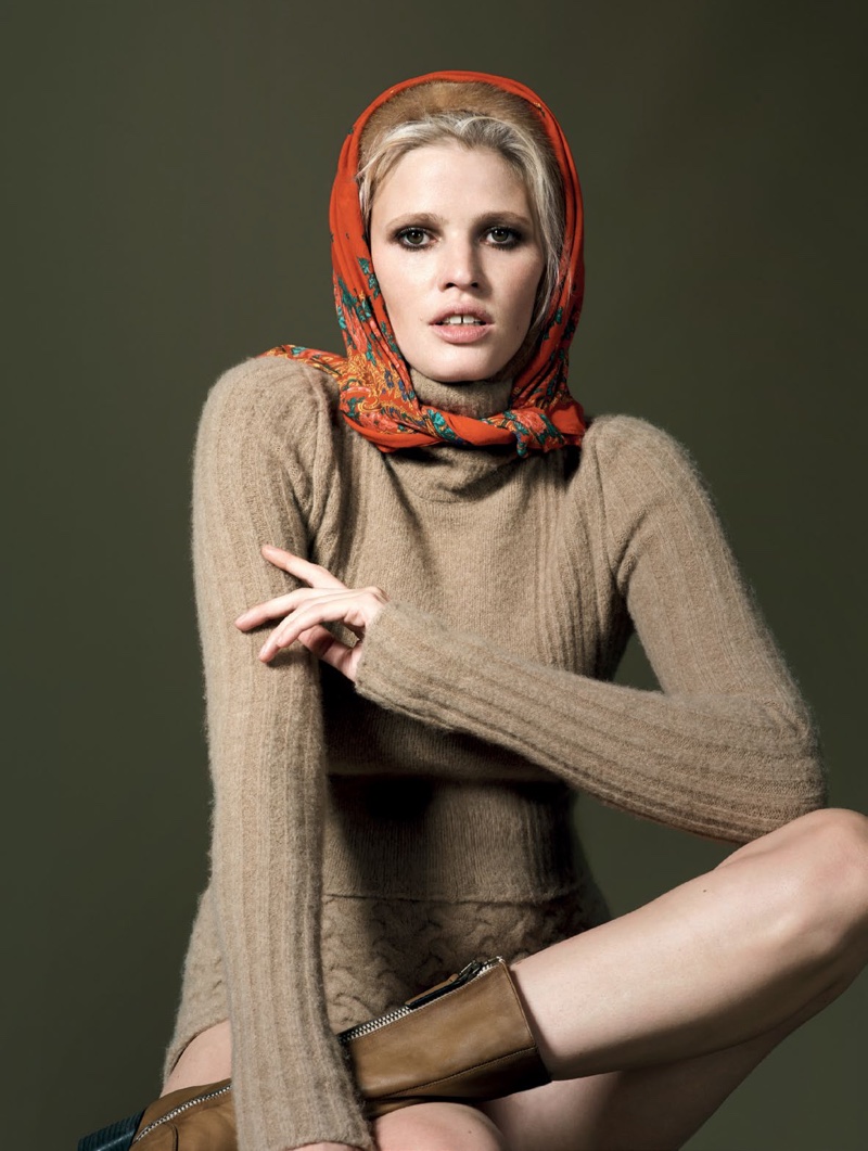 Lara Stone models printed headscarf with pullover sweater and briefs