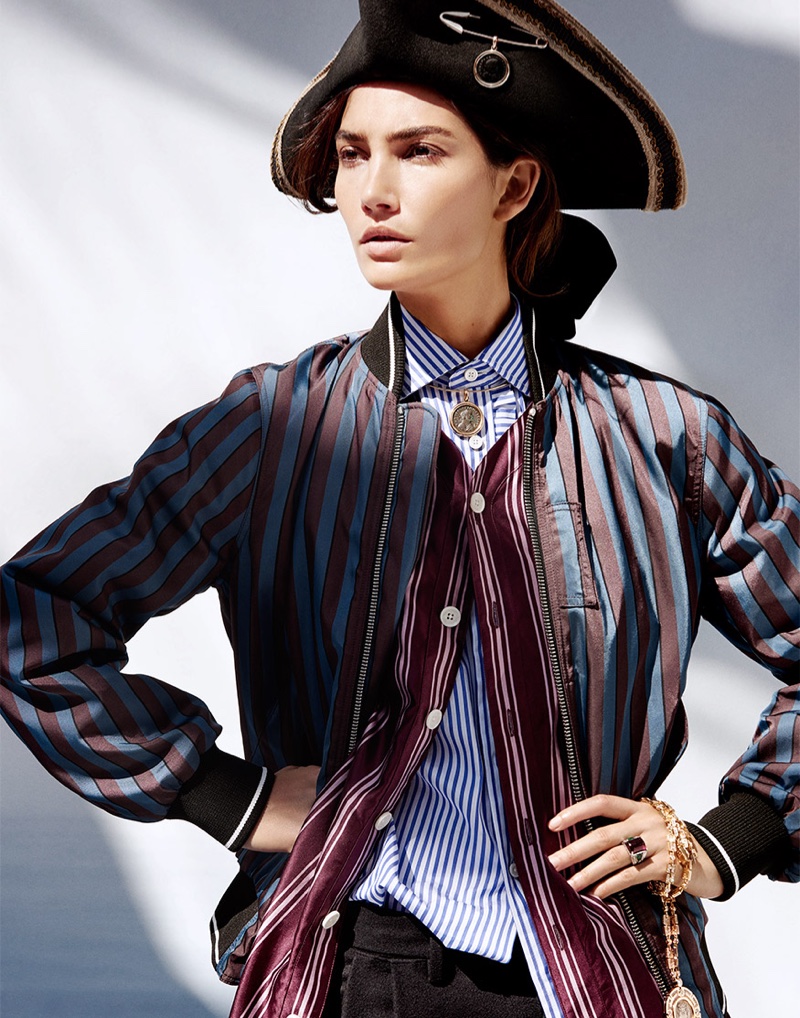 Lily Aldridge stands tall in tricorn hat and striped separates