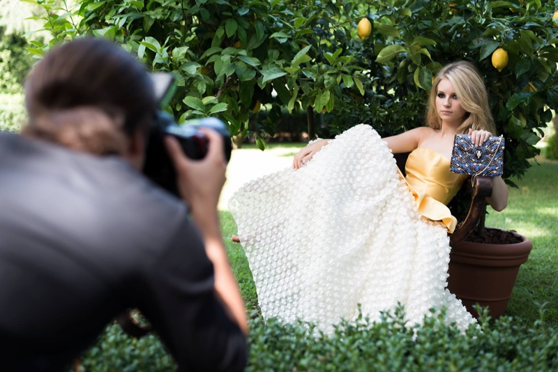 Lottie Moss poses next to lemon trees on Bulgari accessories campaign