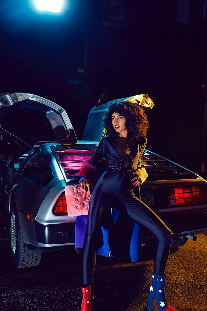 Posing next to a vintage car, Luz Pavon wears full-length bodysuit with Chiara Ferragni boots