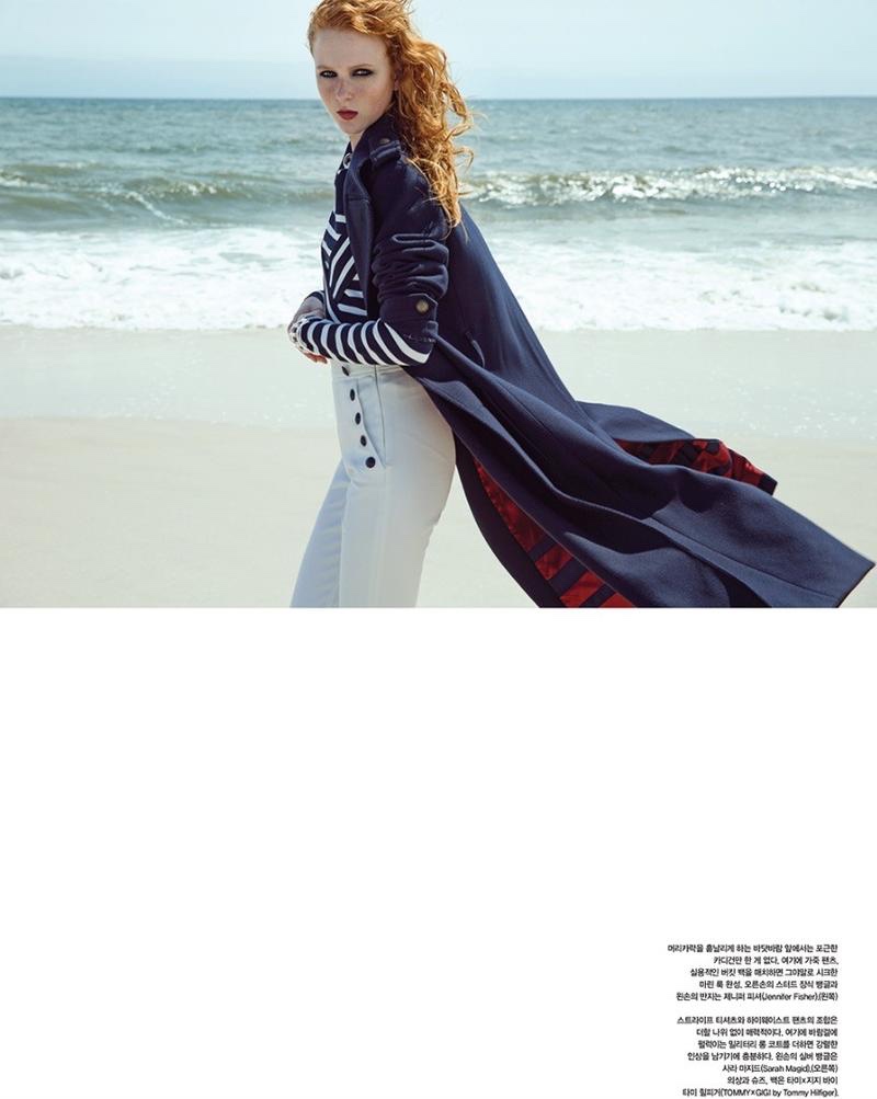 Hitting the beach, Madison Stubbington wears navy coat, striped sweater and trousers from Gigi Hadid x Tommy Hilfiger