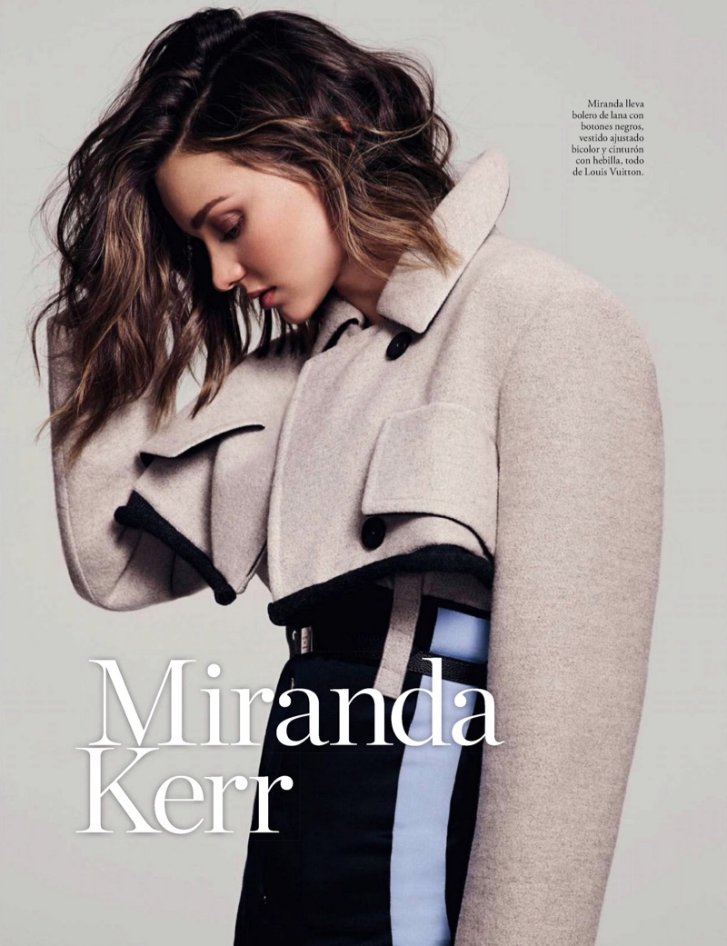 Model Miranda Kerr poses in cropped jacket and bicolor dress from Louis Vuitton
