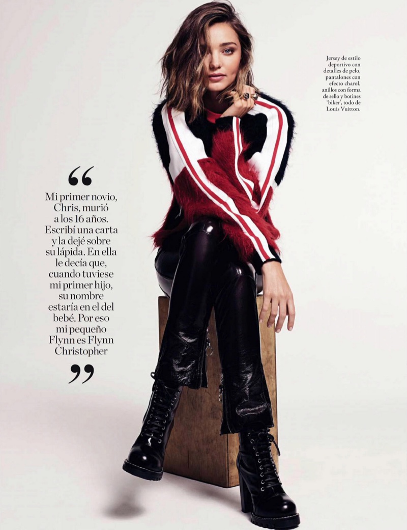 Model Miranda Kerr wears Louis Vuitton embellished sweater, lacquered pants and platform boots