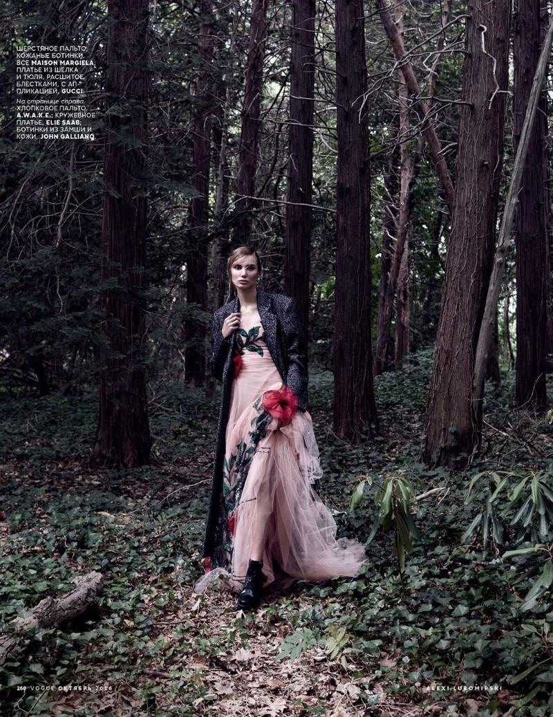 Posing in the woods, Natalia Daragan wears Gucci floral embroidered gown