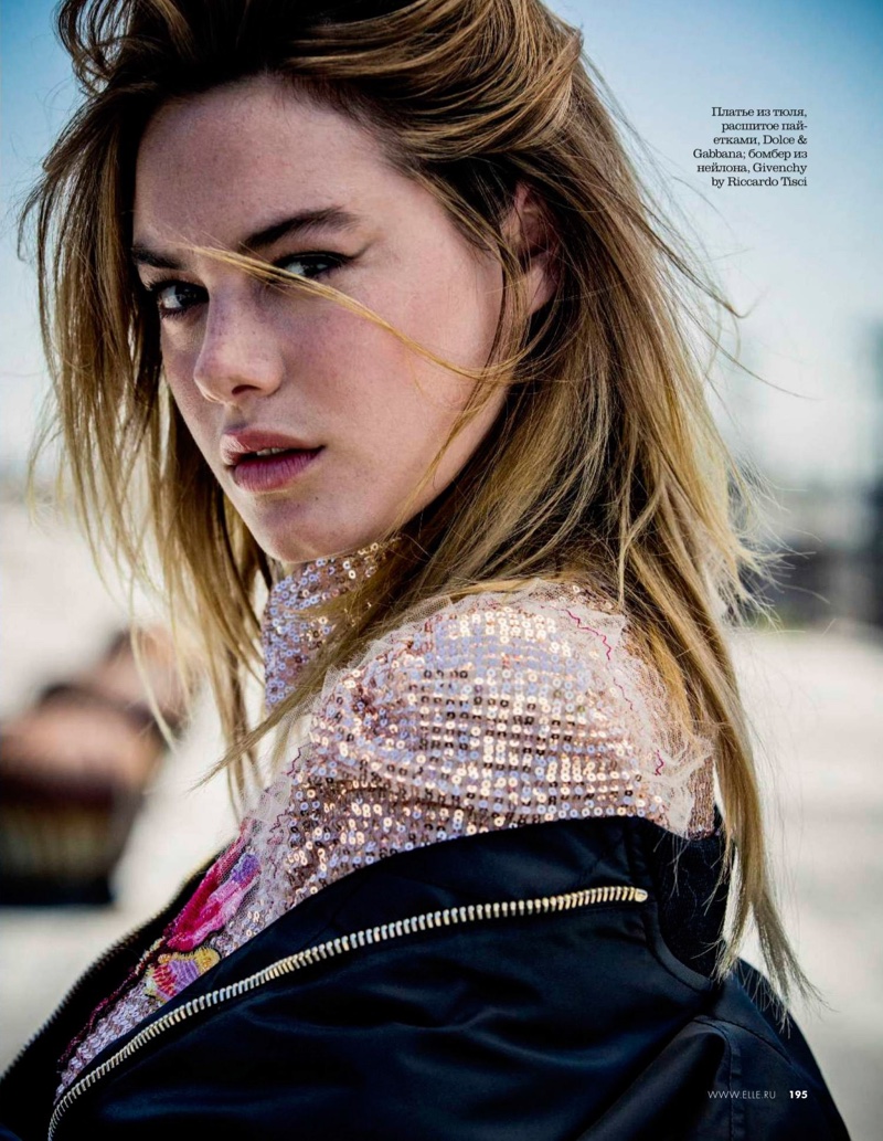 Getting her closeup, Camille Rowe wears sequined Dolce & Gabbana dress with Givenchy jacket