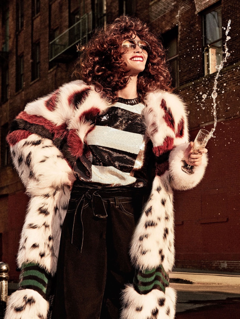 Embracing fur, the model poses in Fendi fox and mink fur coat with Max Mara sequin top and Marc Jacobs velvet pants
