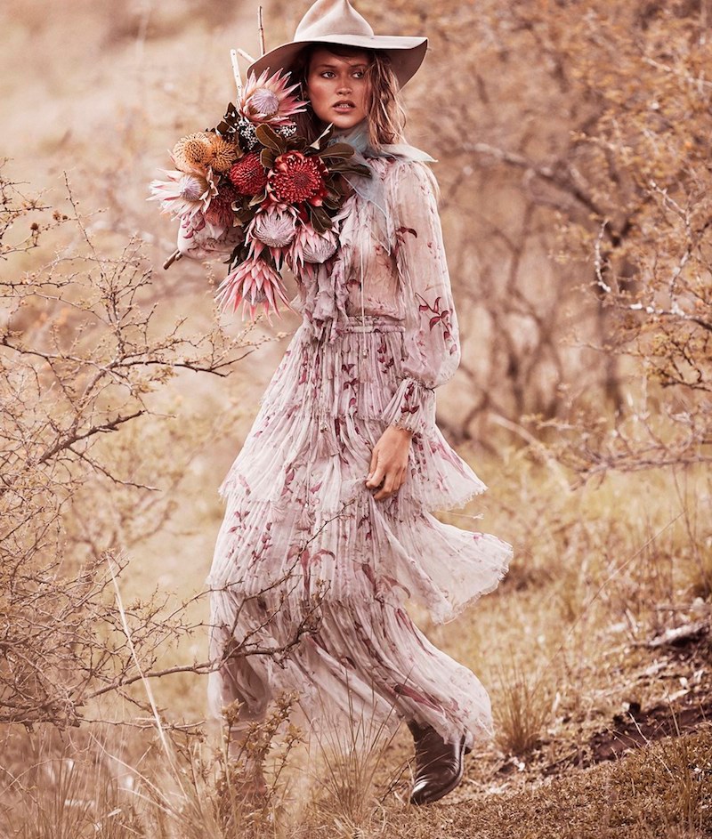 Posing with a bundle of flowers, Chloe poses in Zimmermann pleated dress