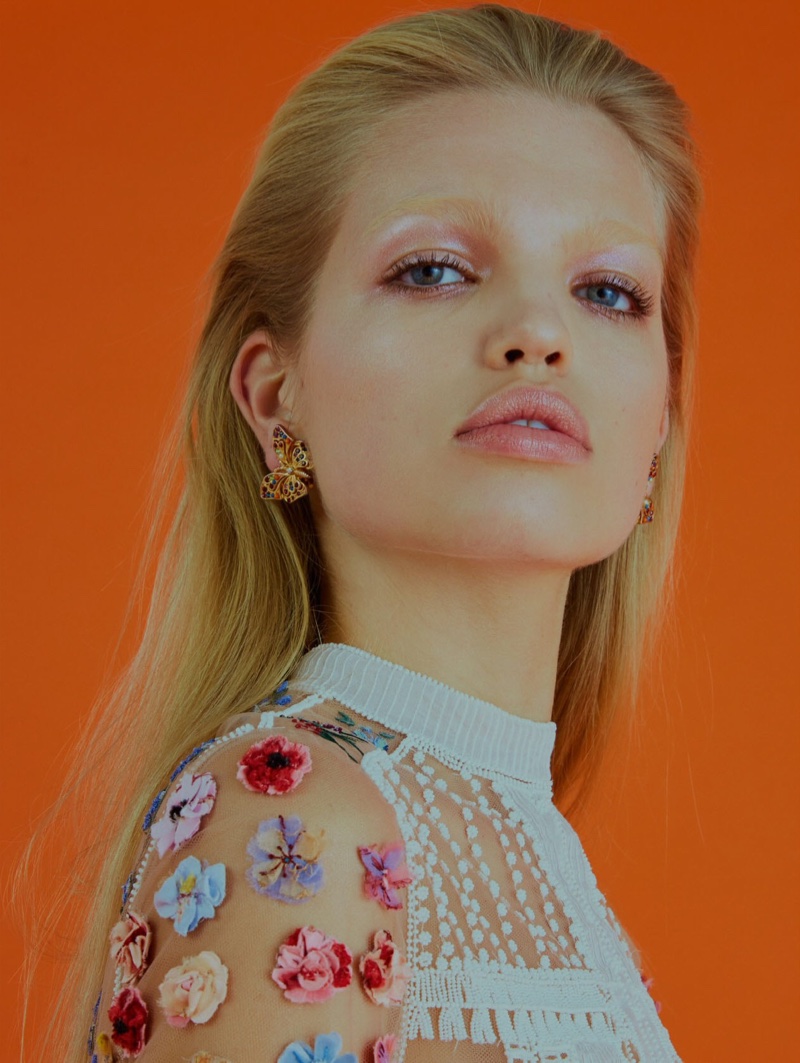 Getting her closeup, Daphne Groeneveld wears floral appliqué top