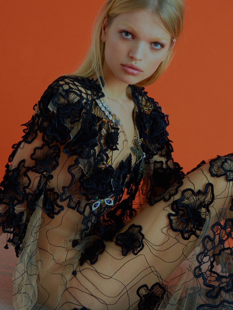 Clad in black and sheer gown, Daphne Groeneveld poses for ELLE UK