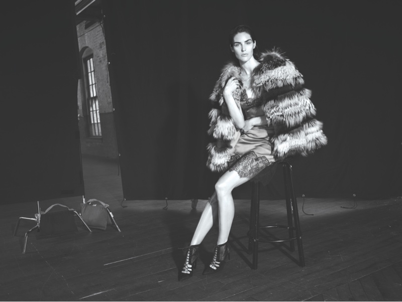 Model Hilary Rhoda poses in fur jacket and slip dress from Dennis Basso