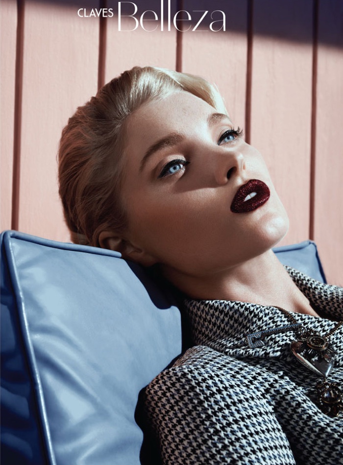 Getting her closeup, Elsa Hosk wears dark plum lipstick with tweed top