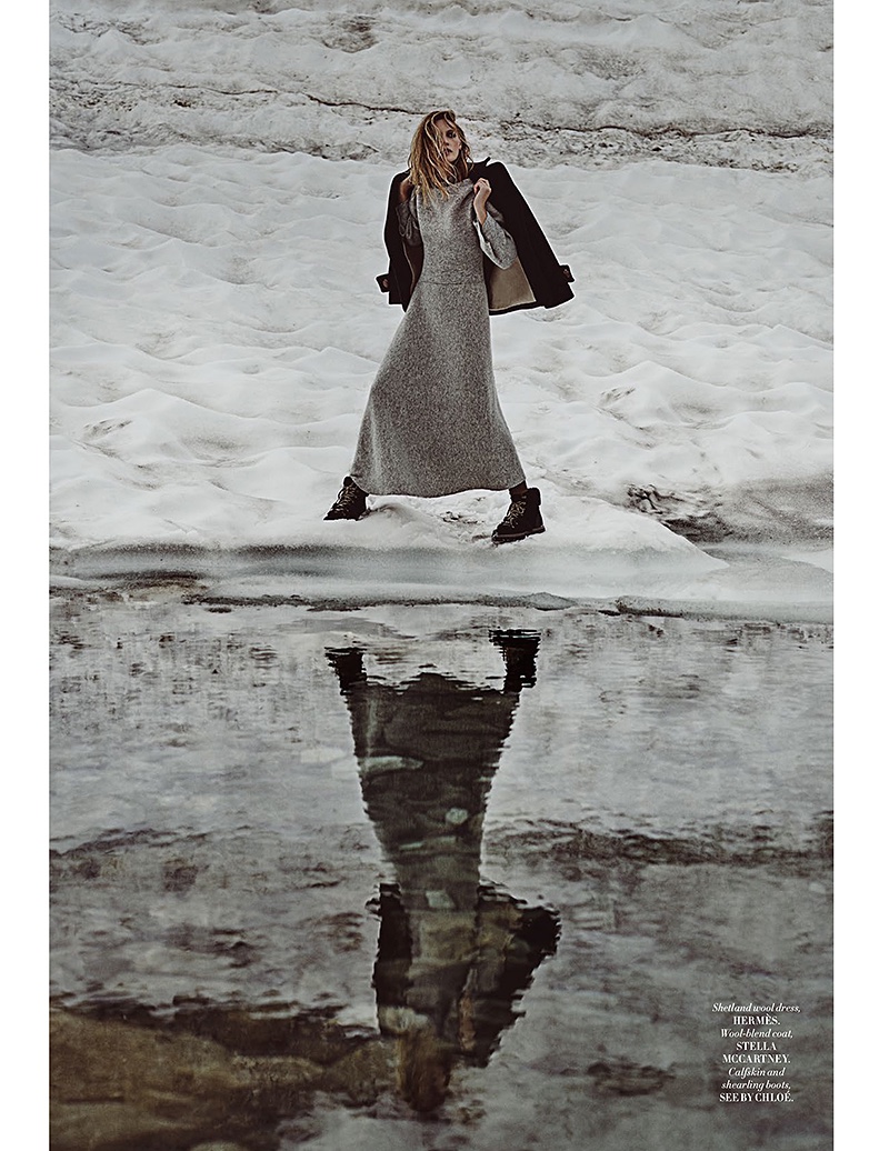 Emma Menteath poses in the snow wearing a shetland wool dress from Hermes with Stella McCartney coat and See by Chloe boots