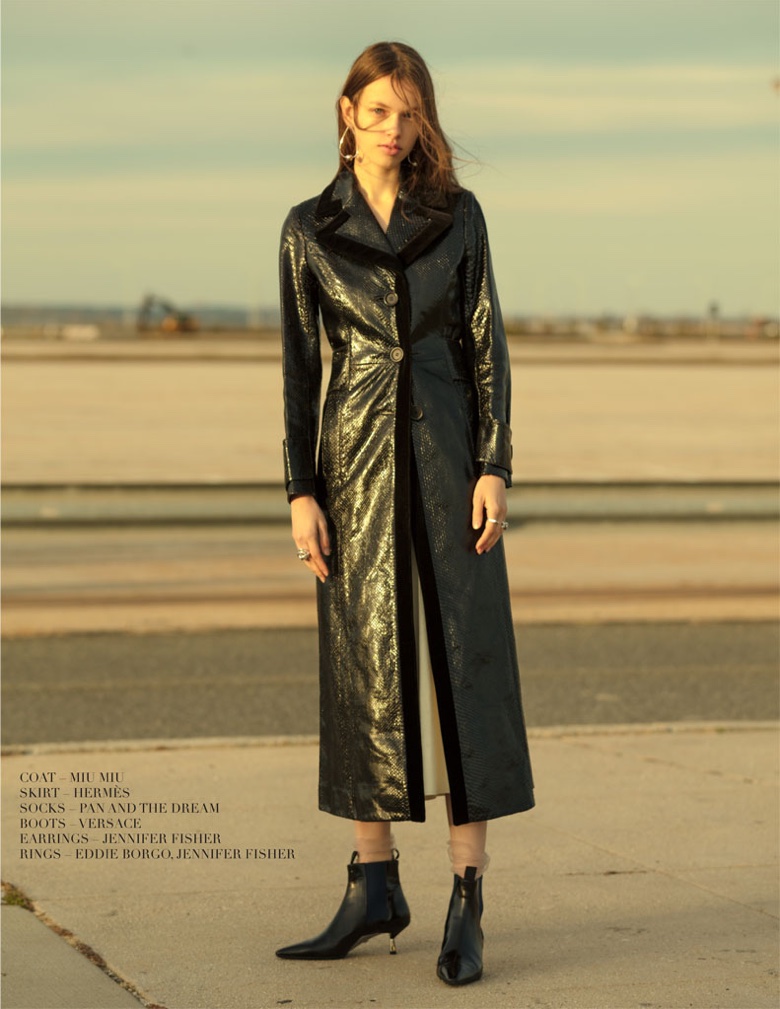 Anniek Abma models Miu Miu coat, Hermes skirt and Versace boots
