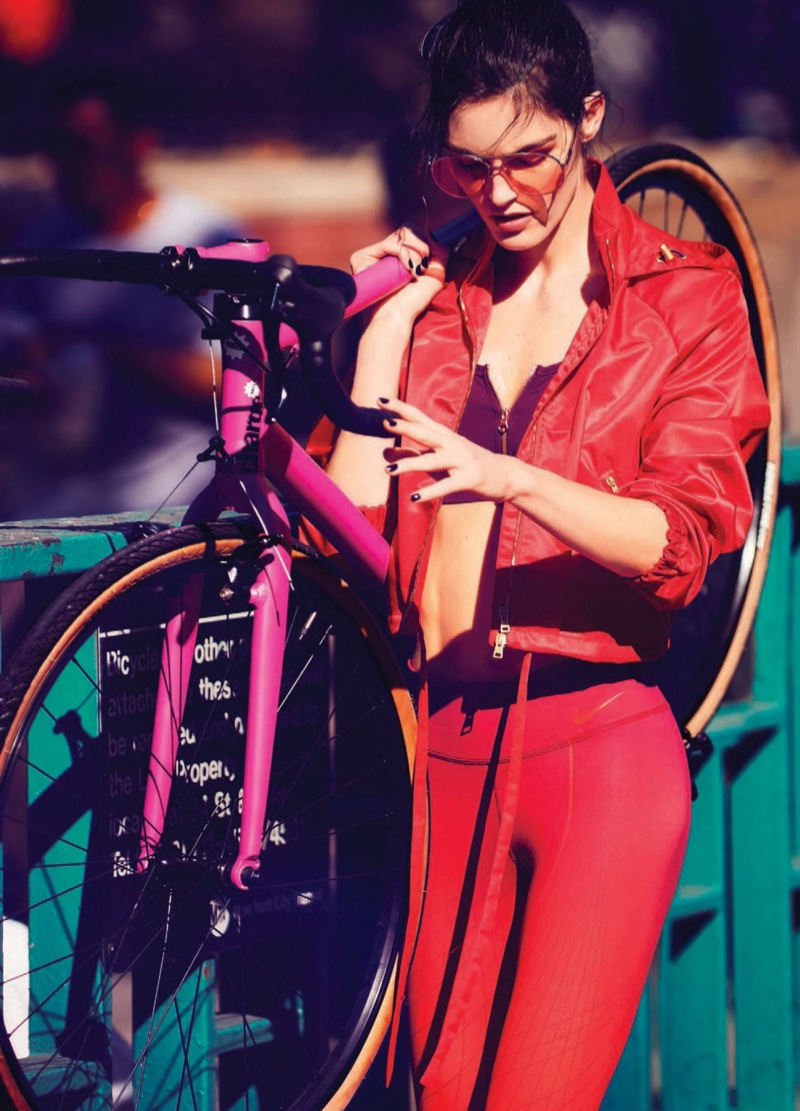 Looking red-hot, Hilary Rhoda wears Hilfiger Collection jacket, Aerie sports bra, Nike leggings and Gentle Monster sunglasses