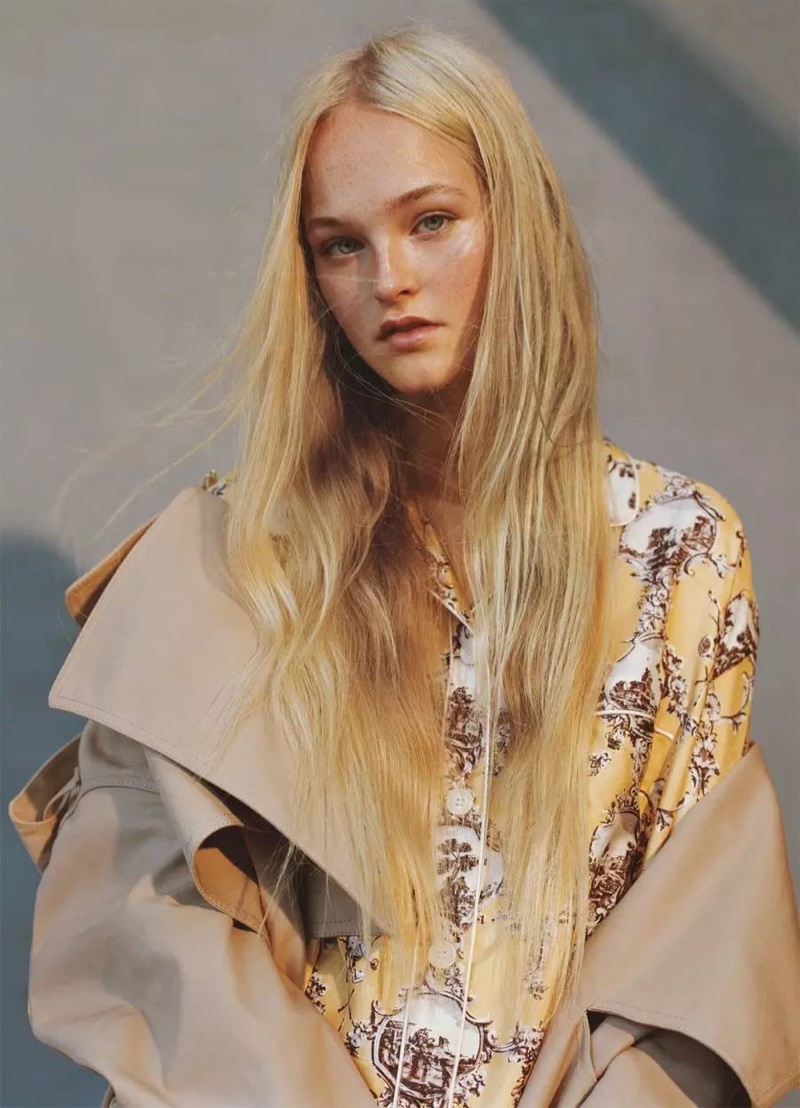 Model Jean Campbell wears Burberry trench coat and printed pajama top 