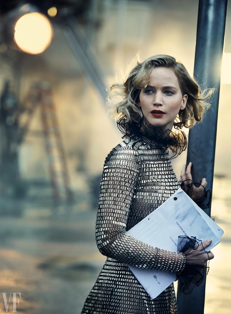 Holding a script, Jennifer Lawrence poses in Valentino Haute Couture gown