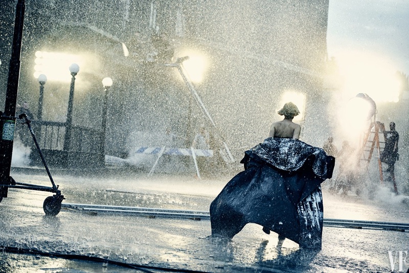 Running in the rain, Jennifer Lawrence poses in Jean Paul Gaultier Haute Couture cape with Dior shoes