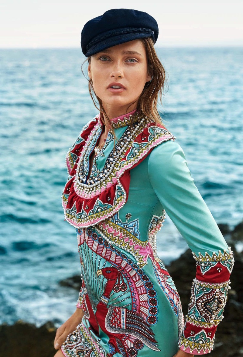 Posing seaside, Karmen Pedaru wears Gucci embellished dress