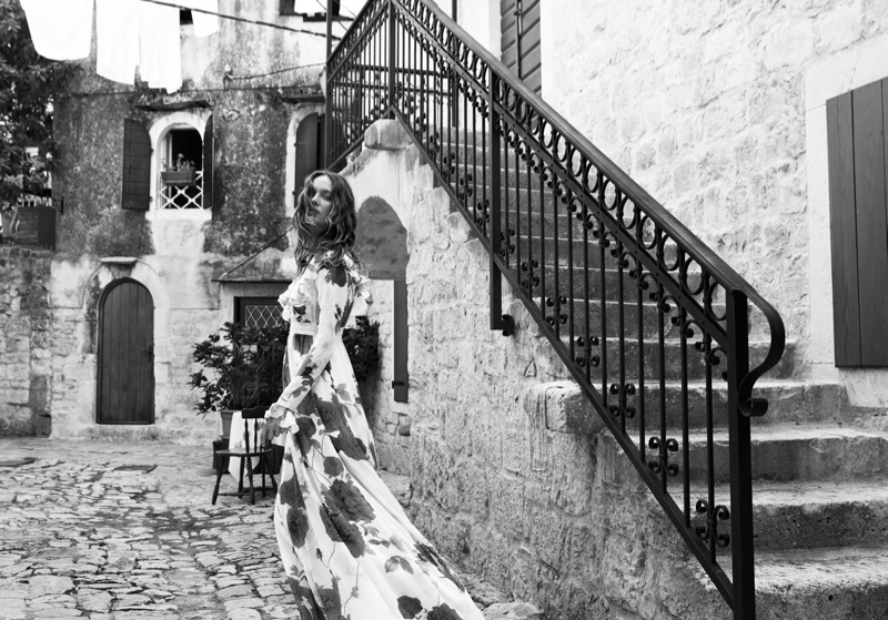 Photographed in black and white, Karmen Pedaru wears printed gown