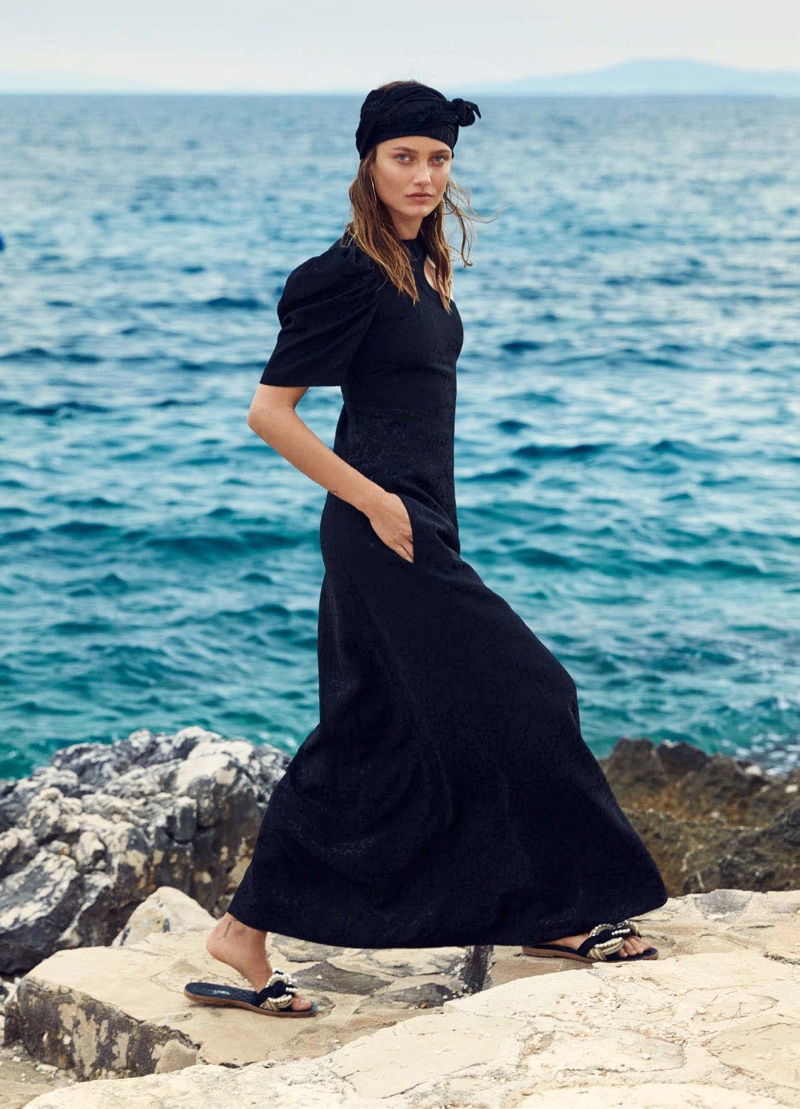 Taking a walk, Karmen Pedaru poses in black dress