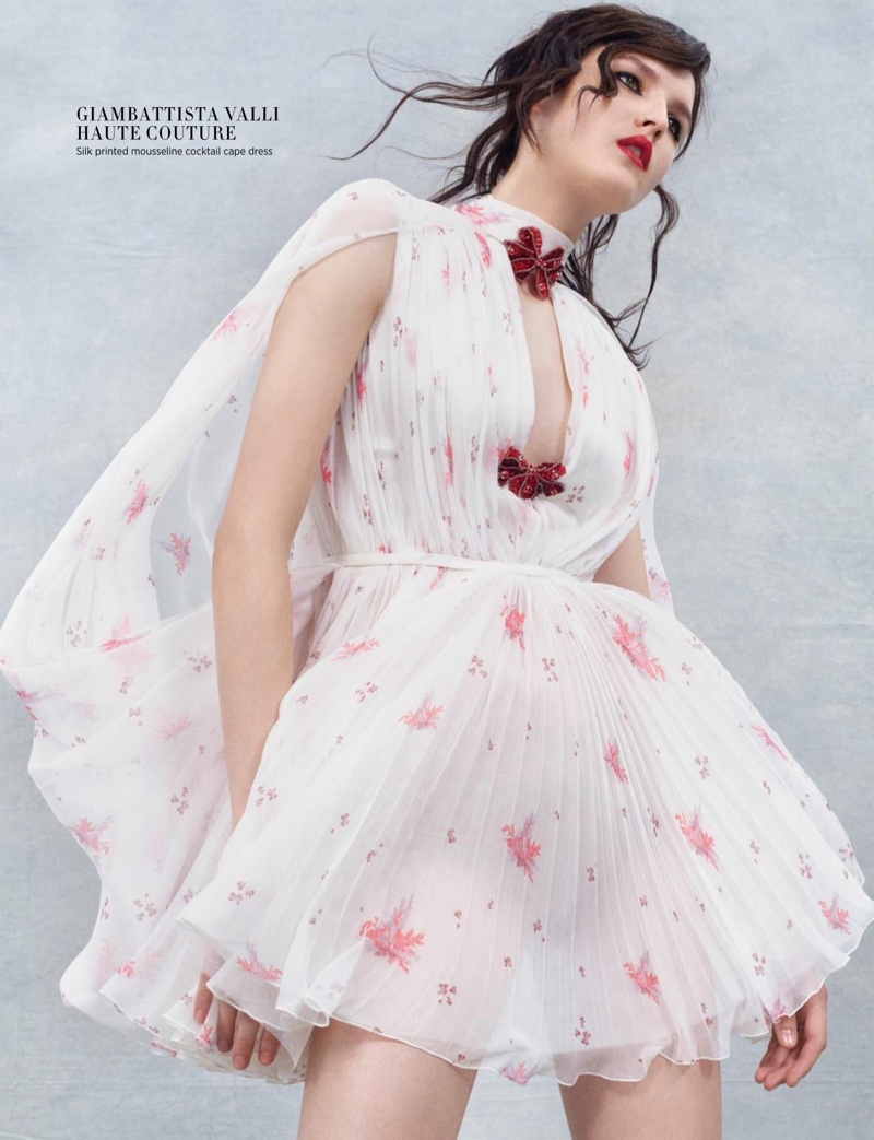 Looking light and airy, Katlin Aas poses in Giambattista Valli Haute Couture silk printed cape dress