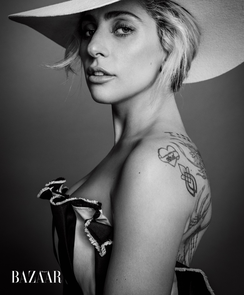 Getting her closeup, Lady Gaga wears Carolina Herrera gown with Gladys Tamez Millinery hat